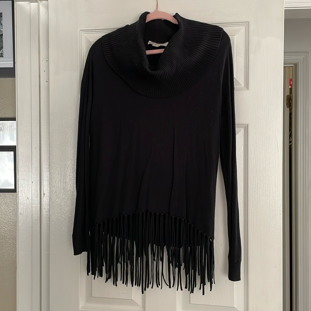 Woman’s black cowl neck sweater